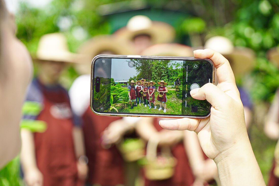 Guests touring the organic farm at Baan Farm Thai Cooking School