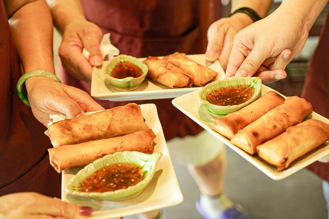 Fresh spring rolls with dipping sauce made at Baan Farm Thai Cooking School