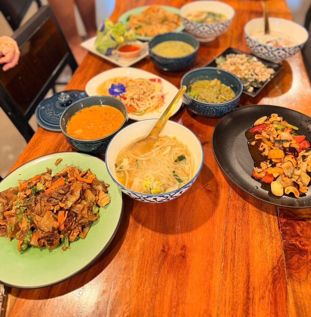 A full spread of dishes cooked by guests at Baan Farm Thai Cooking School